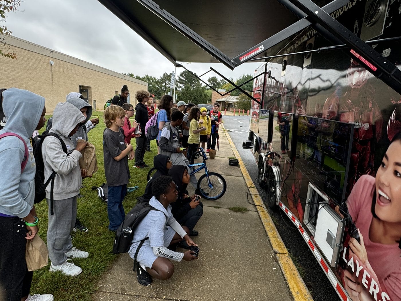 The Next Level Gaming theater arriving for a DMV event with guests gathering